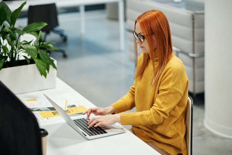 Individual working on laptop