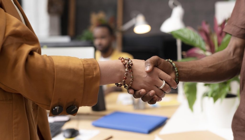 close-up-colleagues-shaking-hands